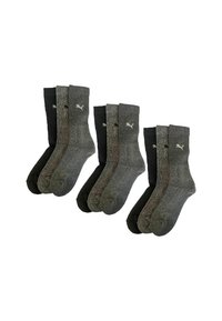 Three sets of black, dark gray, and light gray Puma crew socks arranged in pairs on a white background.