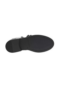 Semelle de chaussure noire avec une texture lisse. Présente un bord légèrement surélevé et un fond en caoutchouc plat pour une meilleure adhérence. Design minimaliste sans motif.