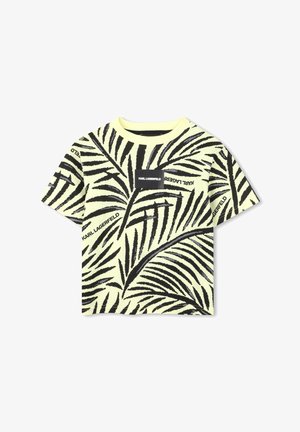 Maglietta gialla a maniche corte con motivo di foglie di palma nere e una piccola toppa nera con il testo "KARL LAGERFELD". Tessuto in morbido cotone.