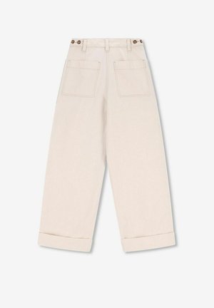Beige wide-leg trousers with a high waist, two back pockets, and button details at the waist. Cuffed hems and a soft, textured fabric.