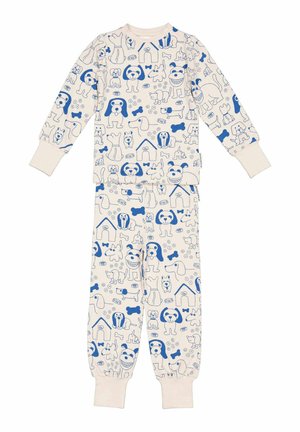 Børnepyjamas i cremefarve med blå tegneseriehundefaces, hundeben, halsbånd og hundehuse trykt over hele stoffet.