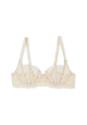 Soutien-gorge en dentelle beige clair avec motif floral, bretelles délicates en satin et bordure festonnée. Comprend un maintien avec armatures et une fermeture à agrafes.