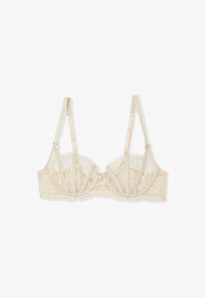 Spitzen-BH in hellem Beige mit floralem Muster, zarten Satin-Trägern und einer gewellten Borte. Mit Bügelunterstützung und Hakenverschluss.