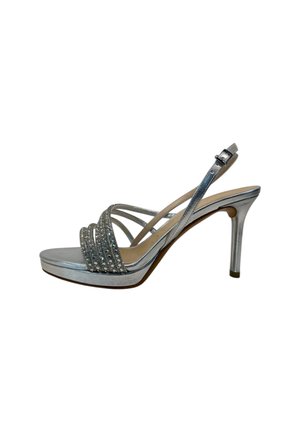 Sandalo argentato con tacco alto, sottili cinturini, decorazioni scintillanti sulle fasce anteriori, fibbia alla caviglia e suola con plateau.