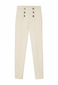 Pantalons taille haute crème avec six boutons d écoratifs métalliques disposés en deux rangées verticales sur la ceinture avant.