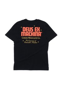 Black cotton t-shirt featuring bold red and yellow text on the back, stating "DEUS EX MACHINA Custom Motorcycle Co." with star accents.