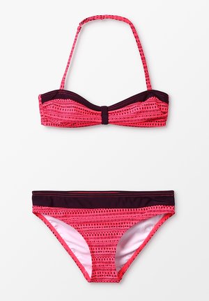 Pink patterned bikini with a bandeau top featuring adjustable straps and a bow detail, paired with a matching low-rise bottom.