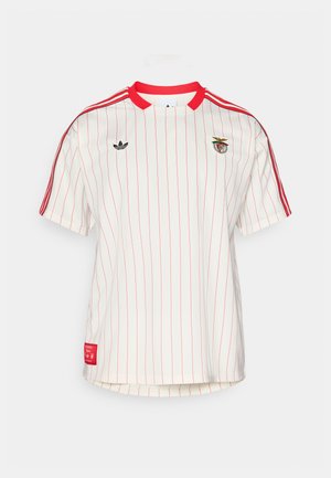 White short-sleeve jersey with red vertical stripes, red collar, and three red shoulder stripes. Features embroidered logo and detail tag.