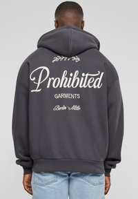 Gray hoodie with a large white text design reading "Prohibited Garments" and decorative accents on the back. Soft fabric, relaxed fit.