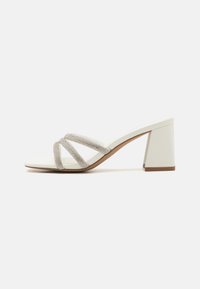 CROWN - Heeled mules - white overflow