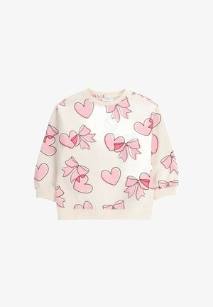 Dziecięcy sweter w kolorze kremowym z różowymi nadrukami serc i kokardek, ściągacze na mankietach i u dołu, odpowiedni do codziennego noszenia.