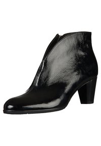 Bottine en cuir verni noir avec fermeture éclair latérale et talon carré, présentant une surface lisse et brillante.