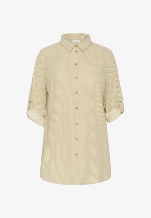 Beige och vit randig knäppskjorta med krage, uppkavlade ärmar och en bröstficka på vänster sida. Tillverkad av tunt tyg.