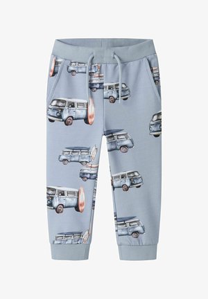 Pantalon de survêtement enfant bleu clair avec imprimé van vintage et planche de surf, taille à cordon et poignets côtelés.