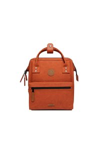 Brown leather backpack with a structured design, top handle, front zip pocket, and logo patch. Features stitching accents and side zip.