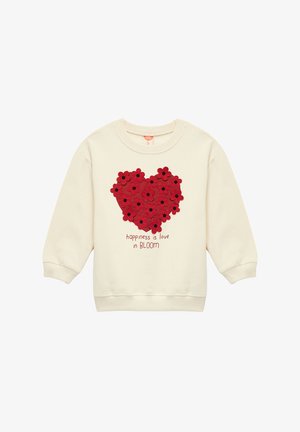 Cremefarvet sweatshirt med et tekstureret rødt blomsterhjerte design og teksten "lykke er kærlighed i BLOOM" nedenfor.