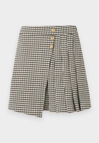 Καρό φούστα σε ασπρόμαυρο με τρία χρυσά κουμπιά, με πιετέ σχεδιασμό και μπροστινή σχισμή. Μαλακή υφή υφάσματος.