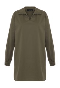 Tunique vert olive avec un col, des manches longues et des poignets élastiques. Fabriquée dans un tissu lisse avec une coupe décontractée et une petite fente à l'avant.