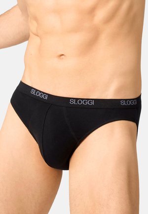 Schwarze SLOGGI Slips mit elastischem Bund, der ein dezentes Logo zeigt. Der Stoff wirkt glatt und hat ein figurbetontes Design mit voller Abdeckung.