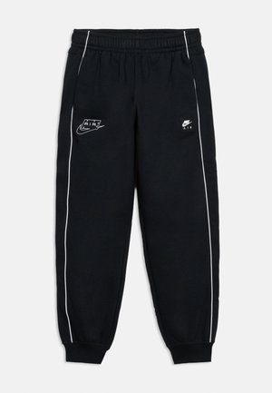 Zwarte Nike Air sweatpants met witte bies langs de pijpen, elastische tailleband, enkelboorden en Nike Air-logo's aan de voorzijde links en rechts.