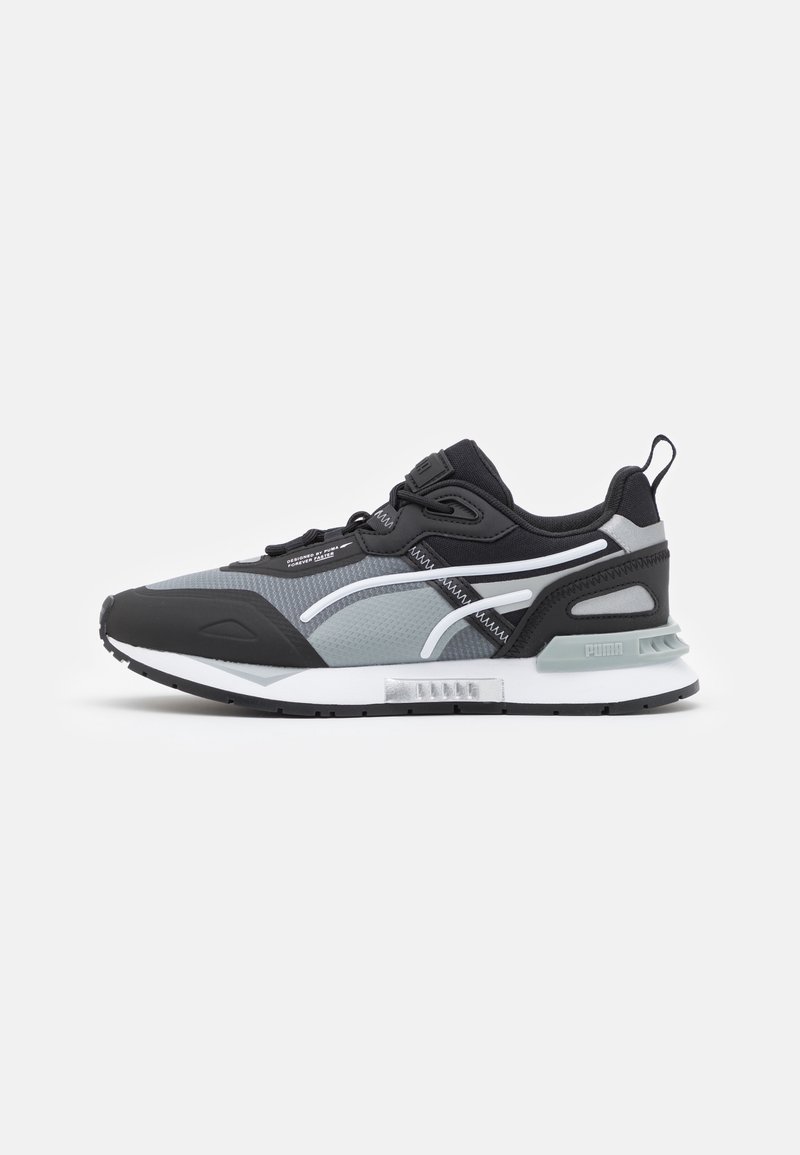Black and grey athletic sneakers featuring a mesh upper, contrasting white accents, a padded collar, and a cushioned white sole.