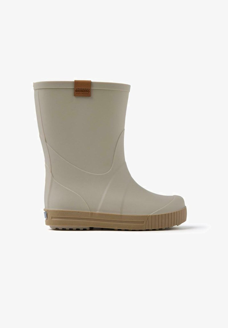 Botas de lluvia de goma beige claro con una suela texturizada en tono marrón. Presenta una etiqueta de cuero marrón y un diseño suave y redondeado.