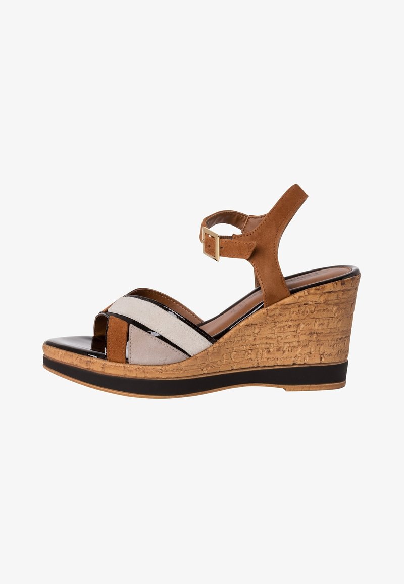 Brown wedge sandal with cork platform, ankle strap with buckle, and multi-textured front straps in brown, black, and beige tones.