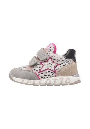 Child's grey and beige sneaker with black spots, pink star detail, two grey velcro straps, and white sole with brand name outline.