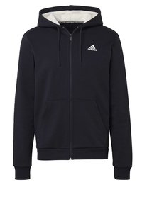 Sweat à capuche noir zippé avec poches avant, capuche à cordon doublée en polaire blanche, et logo Adidas blanc sur la poitrine gauche.