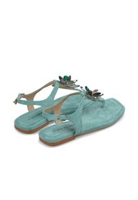 Aqua suede sandals with a flat sole, T-strap design, and decorative flower accents in transparent and green tones. Adjustable ankle strap.