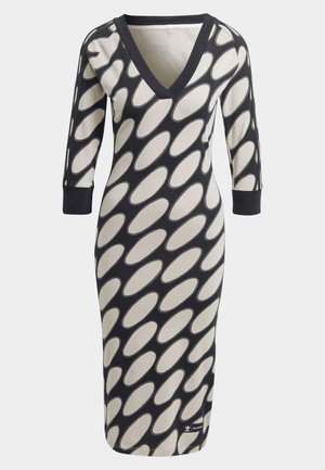 Robe noire et beige jusqu'aux genoux avec des motifs ovales diagonaux, manches trois-quarts et col en V.