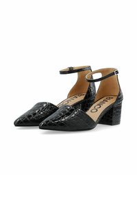 Chaussures à talons hauts en cuir verni noir avec une sangle de cheville, un bout pointu et un motif crocodile texturé. Talon épais.