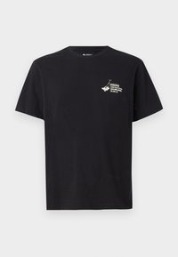 Black cotton t-shirt featuring a graphic print on the left chest. Classic crew neckline and short sleeves, with a soft texture.
