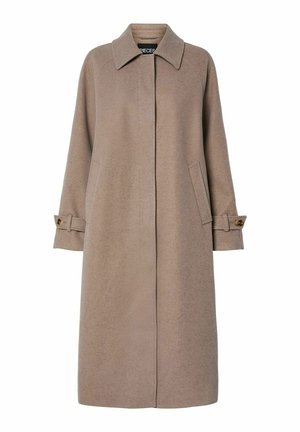 Manteau en laine beige mélangée avec une coupe droite, un col haut et des poches latérales. Présente des accents de boutons sur le poignet des manches longues.