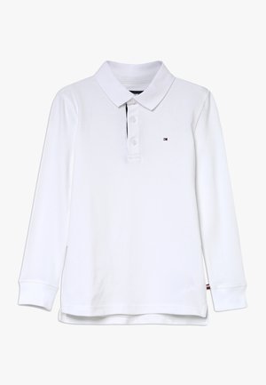 Polo à manches longues blanc en coton, doté d'un col classique, d'une patte de boutonnage à trois boutons et d'un petit logo sur la poitrine.