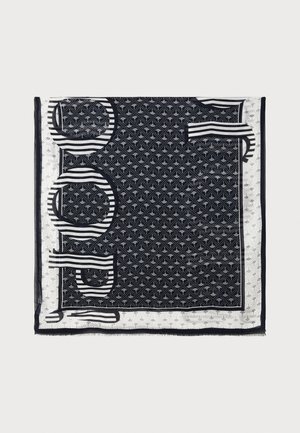 Schwarz-weißer quadratischer Schal mit geometrischen Mustern, Streifen und Fransen. Hergestellt aus leichtem, durchsichtigem Stoff.