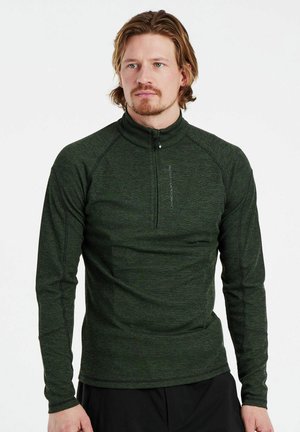 Donkergroene langmouwen top met een kwart-rits kraag, vervaardigd uit textuurstof; beschikt over gestikte accenten en een getailleerd ontwerp.