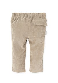 Pantalones de pana beige con cintura elástica y un bolsillo lateral. Textura suave con rayas verticales y diseño de pierna recta.