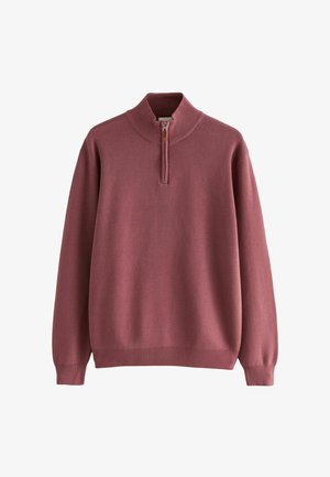 Pulóver en tejido de punto en color malva con un cuello alto y cierre de media cremallera. Detalle de puños y dobladillo acanalados, ajuste relajado.