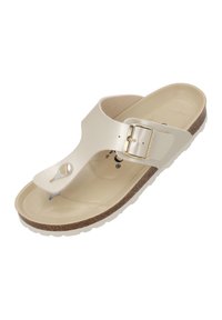 Light beige sandals with a synthetic upper, adjustable strap with a buckle, molded footbed, and a textured cork-wrapped sole.