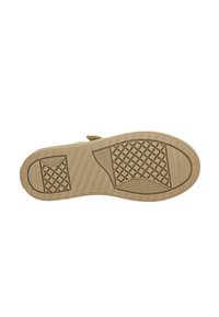 Semelle en caoutchouc beige avec une surface texturée. Les caractéristiques incluent des rainures en relief, un bout arrondi et un talon plat pour la stabilité.