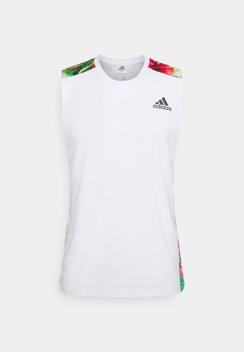 Biała bezrękawnik sportowy z akcentami w kwiatowy wzór na ramionach i bokach. Z przodu znajduje się czarne logo adidas.