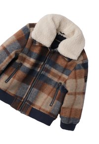 Brązowa i niebieska kurtka w kratę z kołnierzem z sztucznej owczej wełny, kieszeniami na zamek i ściągaczami, wykonana z miękkiej dzianiny wełnianej.