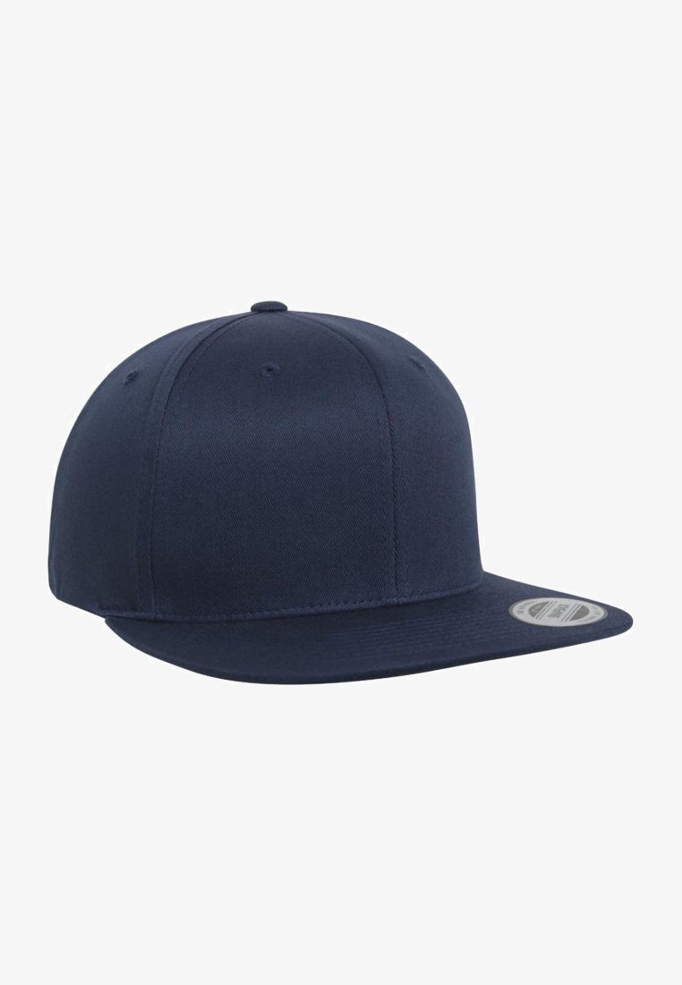 Navy blue baseball cap made of fabric, featuring a flat brim and a structured crown with six-panel design and ventilation eyelets.