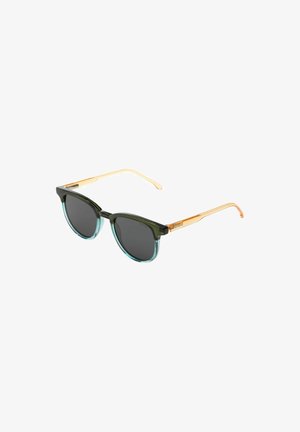 Lunettes de soleil avec une monture vert-noir, des verres bleu clair transparents et des branches en métal doré. Forme ronde notable et design élancé.