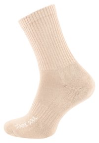 Calzino rigato beige con una texture morbida, caratterizzato da un tallone e una punta rinforzati. Logo "STARK SOUL" in bianco sul lato.