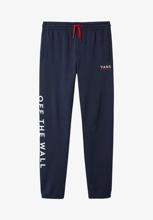 Pantalon de jogging Vans bleu marine avec cordon rouge, poches latérales, poignets élastiques, logo "VANS" avec étoiles sur la poitrine et texte "OFF THE WALL" en vertical sur la jambe gauche.