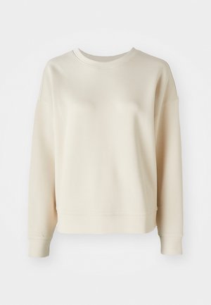 Cream-colored sweatshirt with a round neckline, drop shoulders, and ribbed cuffs. Smooth texture and relaxed fit. Simple, minimal design.