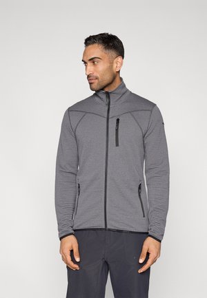 Graue Jacke mit Reißverschluss aus strukturiertem Stoff, Stehkragen und schwarzen Reißverschlusstaschen. Mit kontrastierenden Nähten und figurbetontem Schnitt.