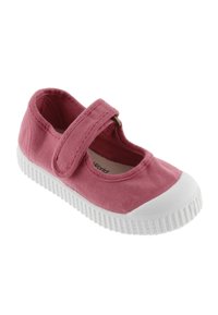 Zapato Mary Jane de lona rosa con suela de goma blanca y correa de Velcro, diseñado para uso informal.